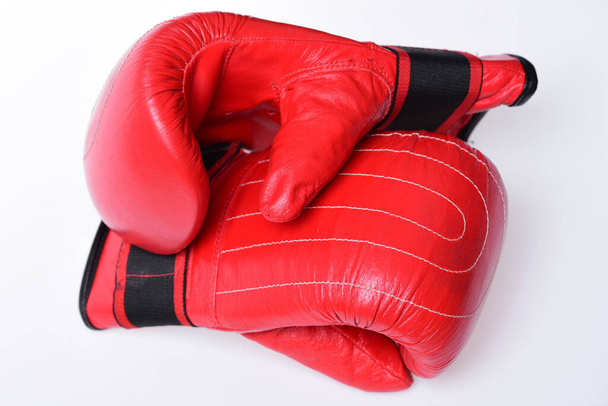 Pair of boxing gloves lying next to each other. - Fotografie, Obrázek
