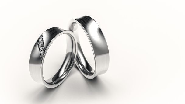 Par de anillos de plata con diamantes pequeños para los amantes
 - Foto, Imagen
