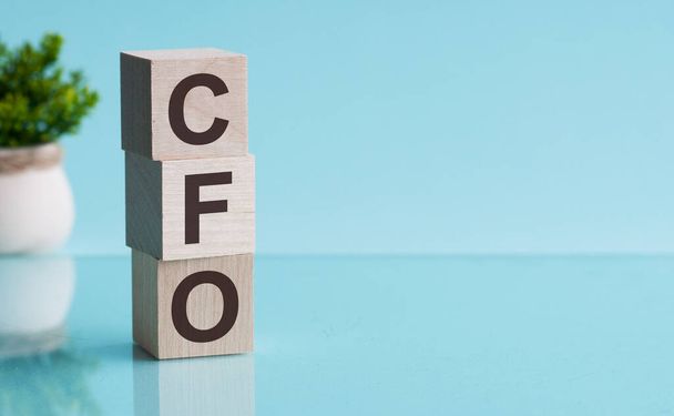 Letter of the alphabet of CFO on a light blu background. - Fotoğraf, Görsel