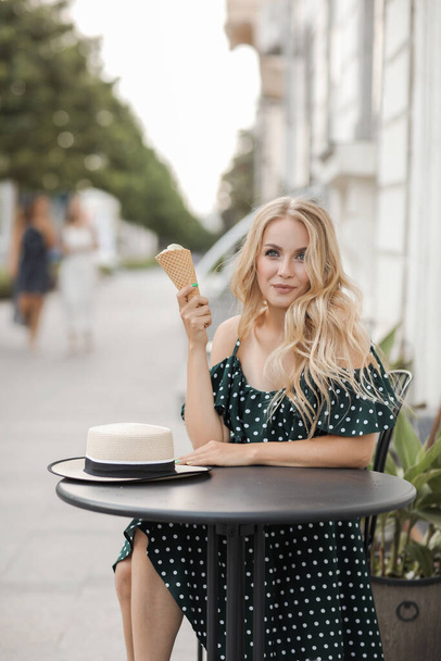 Beautiful smiling woman with ice cream outdoor, fashion portrait girl with hat - Zdjęcie, obraz