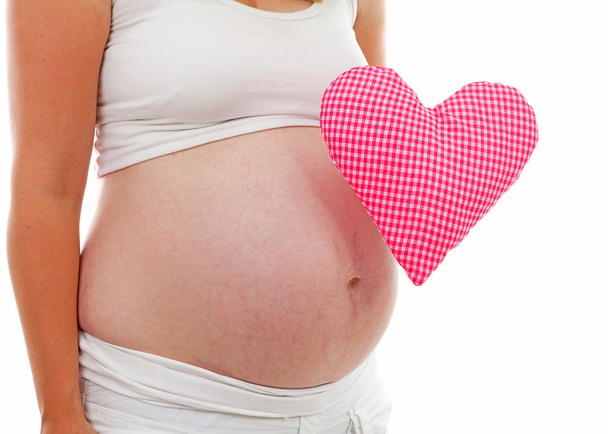 pregnant belly with checkered heart - Photo, Image