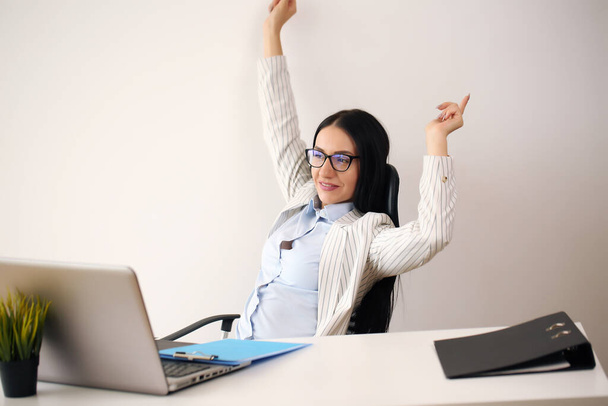 Happy excited successful businesswoman triumphing in office - Фото, зображення