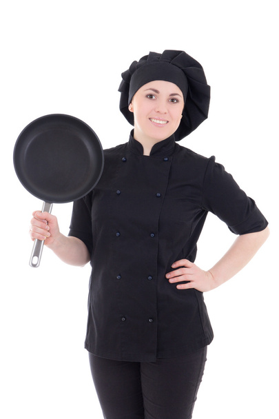 mladý kuchař žena v černé uniformě s pánev izolované na wh - Fotografie, Obrázek