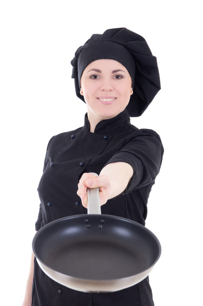 mladý kuchař žena v černé uniformě s teflonovou pánev izolátu - Fotografie, Obrázek