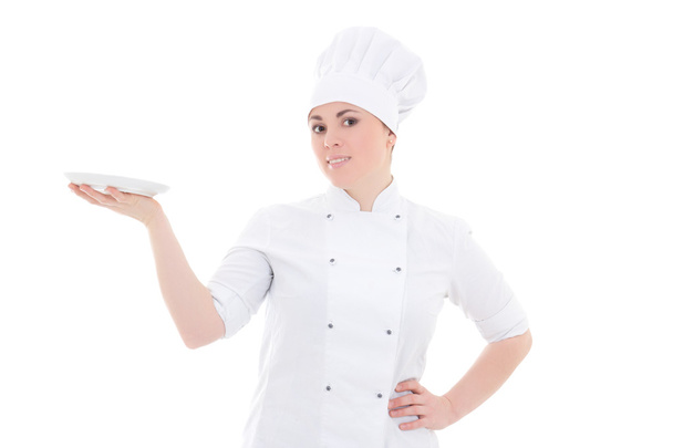 mulher jovem cozinheiro de uniforme com prato vazio isolado no branco - Foto, Imagem