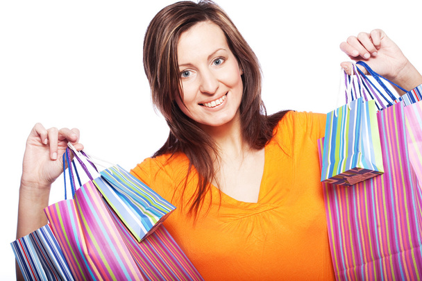 Woman happy holding shopping bags. - 写真・画像