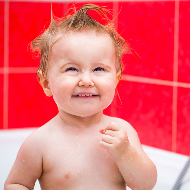cute 1 year-old girl bathes - Photo, Image