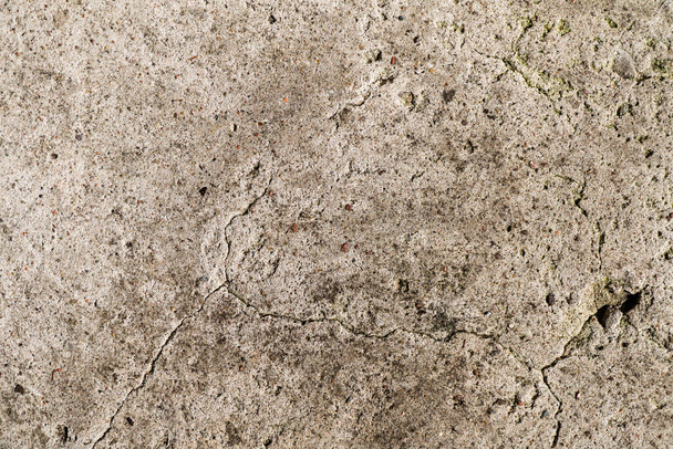 Un muro di cemento molto vecchio è una superficie decorativa o strutturata. Può essere utilizzato come sfondo o per scopi di progettazione - Foto, immagini