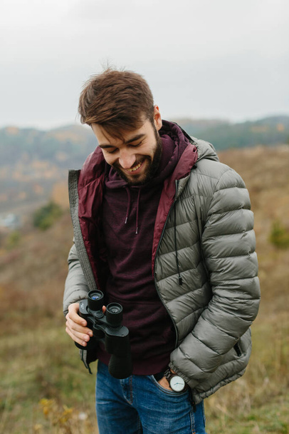 young traveler man with binoculars - Photo, Image
