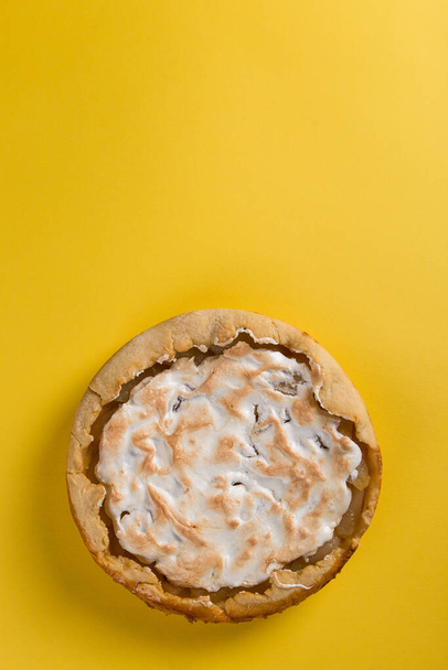 Pear pie on a blue napkin on yellow background, the concept of homemade delicious pastries. Copy space. - Foto, Imagem