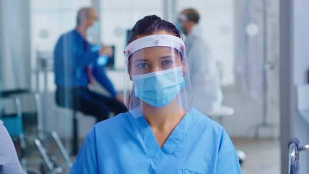Medical assistant with visor and face mask - Photo, Image