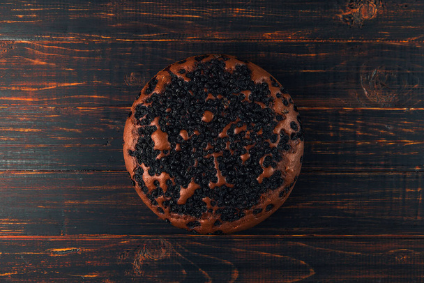 Blueberry pie with berries, homemade fresh pastries, on wooden background. Copy space. - Fotó, kép