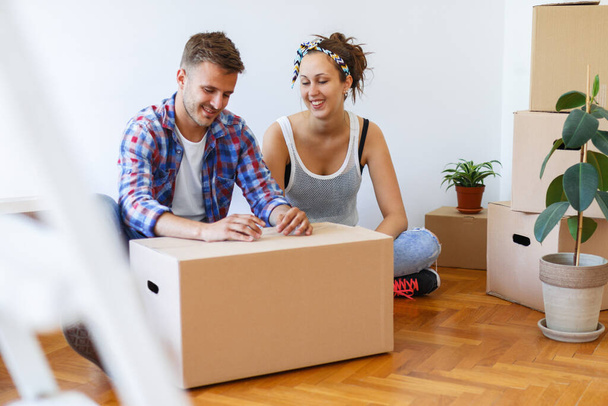 Unpacking and happiness in a new home - Photo, Image
