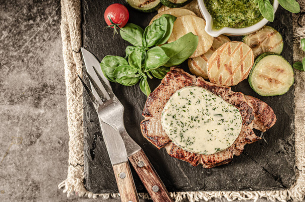 Grilled steak with herbs butter, grilled vegetable with garlic - Fotoğraf, Görsel