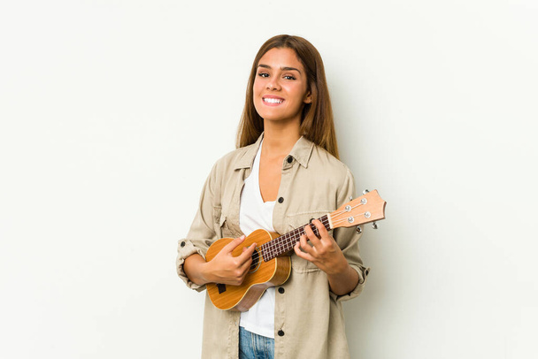 Young caucasian woman playing ukelele isolated - Foto, immagini