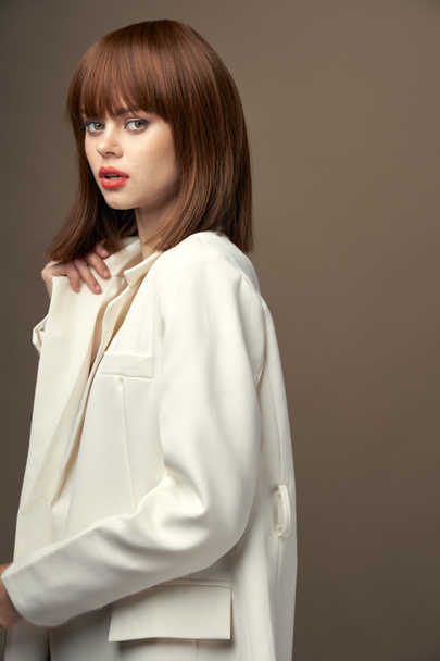 Pretty model in beige jacket gesticulate with hands  - Fotografie, Obrázek