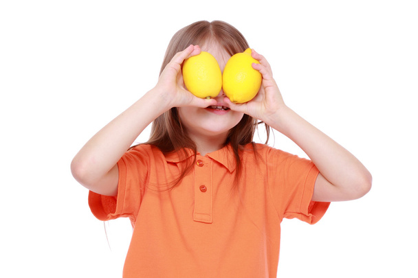 Girl with lemons - Foto, imagen
