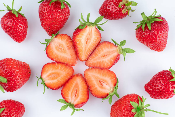 Pattern of fresh strawberries on a white background - 写真・画像