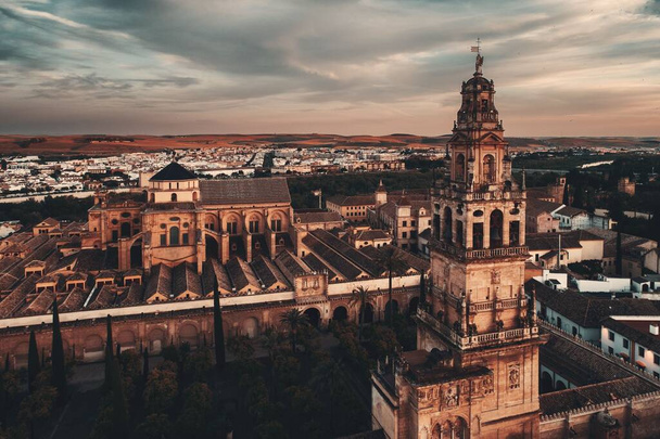 The MosqueCathedral bell tower of Cordoba aerial view at sunset night in Spain. - Фото, изображение
