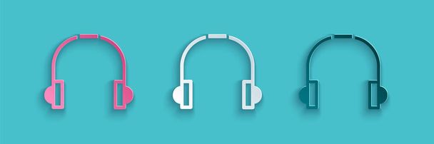 Papel corte Headphones ícone isolado no fundo azul. Fones de ouvido. Conceito para ouvir música, serviço, comunicação e operador. Estilo de arte de papel. Ilustração vetorial. - Vetor, Imagem