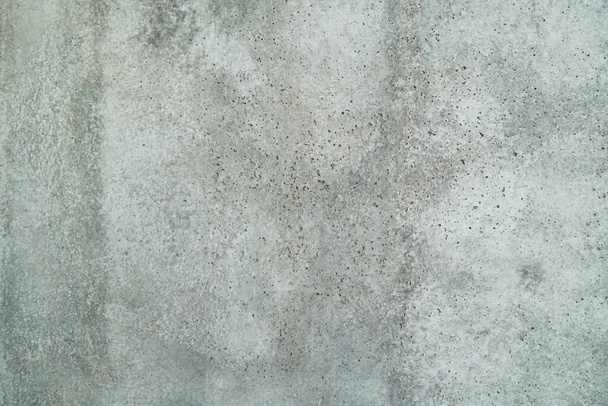 Texture of a smooth gray concrete wall as background or wallpaper. Close up of concrete wall with rough texture. Cement texture. - Foto, imagen