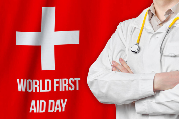 Konzept zum Welttag der Ersten Hilfe mit Arzt vor rotem Hintergrund. - Foto, Bild