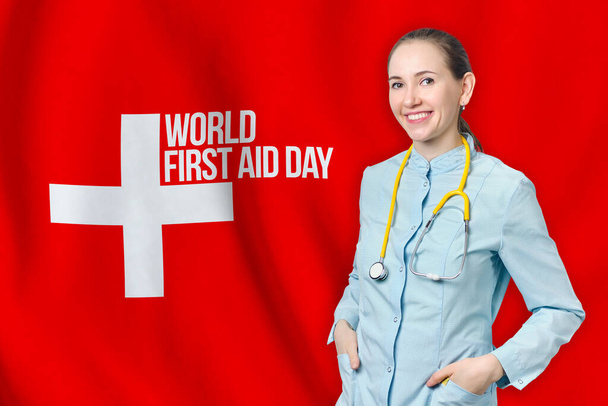Konzept zum Welttag der Ersten Hilfe mit Ärztin vor rotem Hintergrund. - Foto, Bild