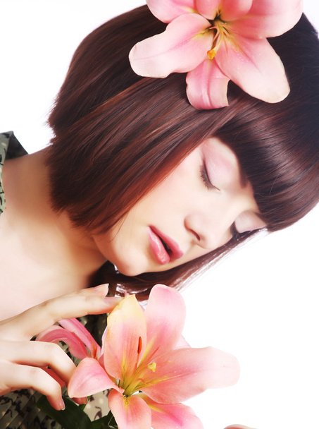 Portrait of beautiful woman with pink lily flower - Fotó, kép