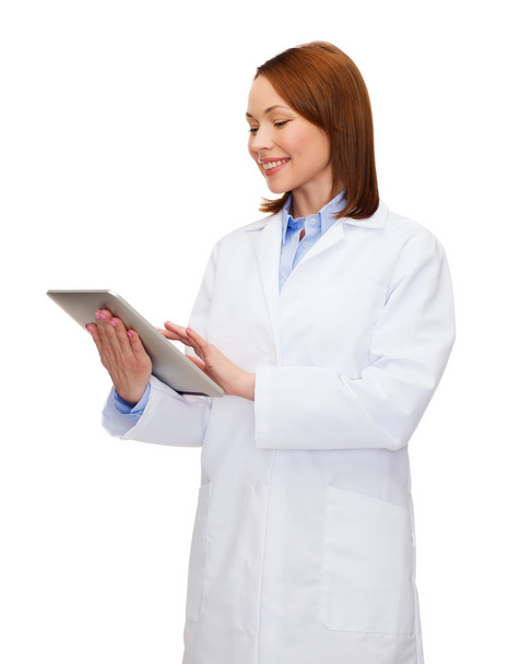 Smiling female doctor and tablet pc computer - Foto, Bild