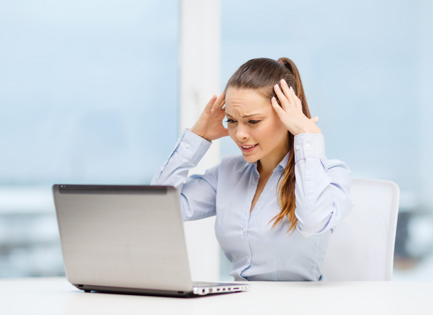 Stressed woman with laptop - 写真・画像