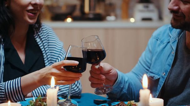 Couple with red wine glasses - Photo, Image