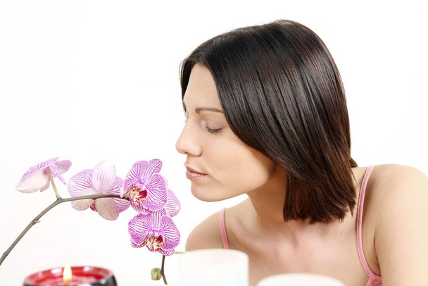 young woman smelling flower - Photo, Image