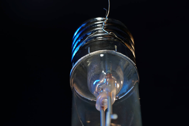 A closeup shot of an electric light bulb - Photo, image