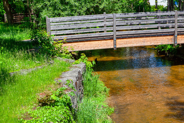 Wooden footbridge over a small river  - Photo, Image