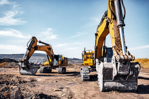Group of yellow excavator working on construction open mining site - Photo, Image