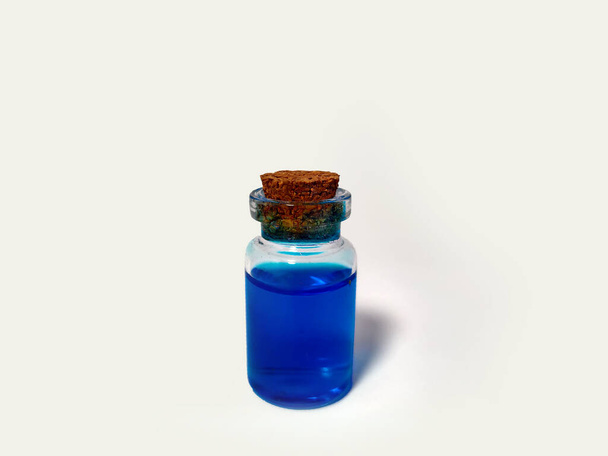 Potion with blue mana liquid. Alchemy set with flask. small glass bottle with colored liquid for game role play. magic potions with cork stopper for larp. bottles and potion. color flask hd. - Photo, Image