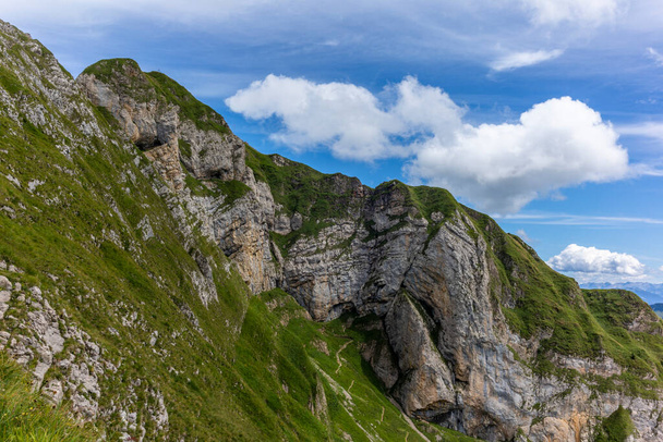 The  steep path leading to the majestic  Schaefler peak in the  Alpstein mountain range around the Aescher cliff in Appenzell, Switzerland - Foto, Imagen