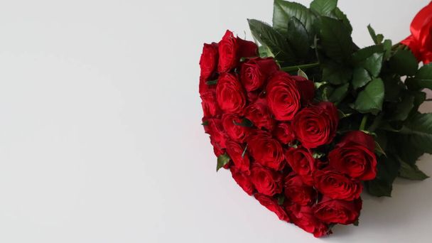 bouquet of red roses on a light background - Photo, Image