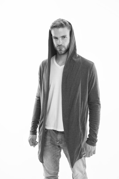 Fashion trend. Street style outfit. Handsome man with hood standing white background. Clothes daily wear. Menswear concept. Casual and comfortable. Male fashion influencer. Fashionable model man - Foto, afbeelding
