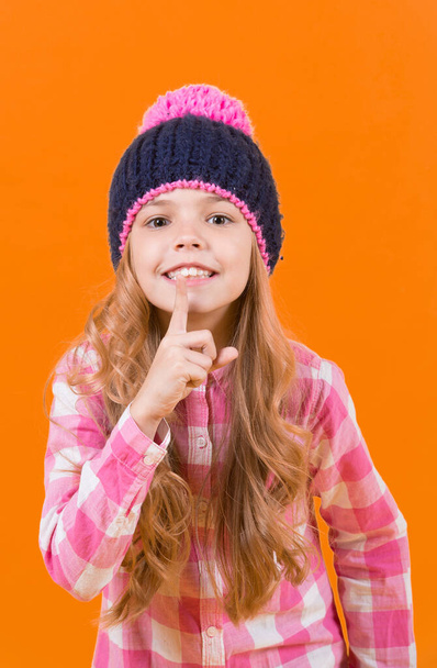 Girl in hat, plaid shirt smile on orange background - Photo, image