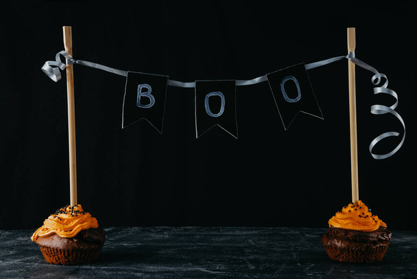  Halloween sweets, chocolate cupcakes on a black background. Copy space - Φωτογραφία, εικόνα