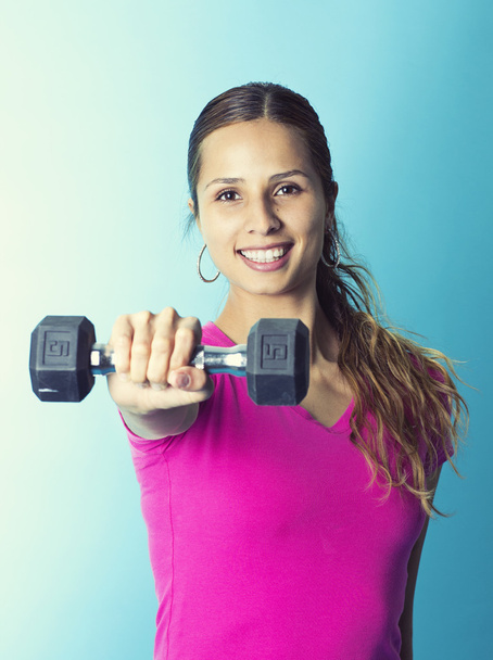 Hispanic fitness woman lifting weights - Photo, Image