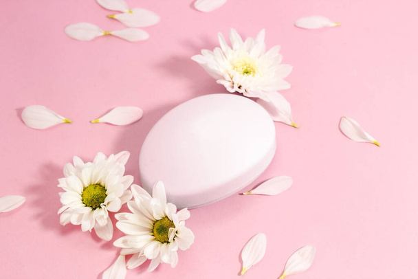 Chrysanthemum and petals with natural body and face soap. Space for text. - Foto, Bild
