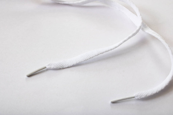 White shoelaces on a white background close up - Photo, Image