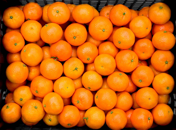 Tuoreita mandariiniappelsiineja. Tausta oranssi hedelmät. - Valokuva, kuva