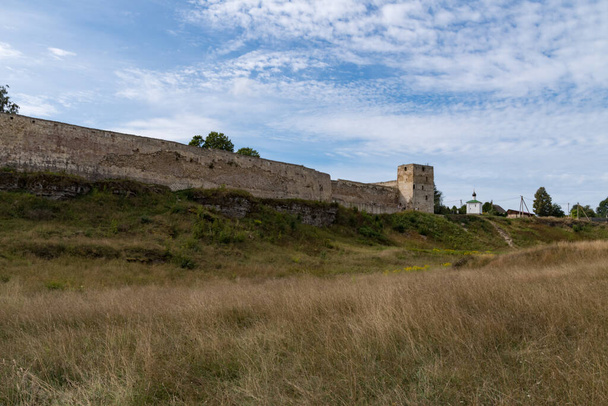 Medieval Izborsk fortress wall,  Talavskaya tower and Chapel of the Korsun Icon of the Mother of God. Izborsk, Pskov region, Russia. - Photo, Image