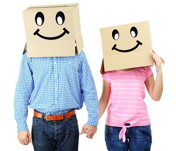 Couple with cardboard boxes on their heads isolated on white - Fotografie, Obrázek