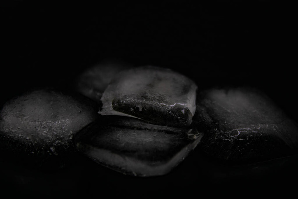 Ice cubes on a black background close up - Foto, Imagem