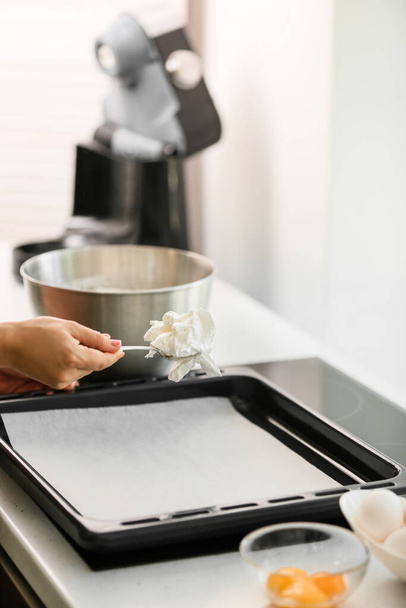 Woman preparing meringue for baking in kitchen - Foto, Imagem