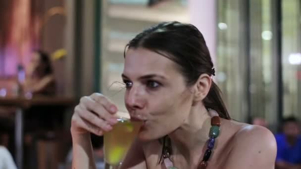 Woman drinking cocktail in bar - Filmmaterial, Video